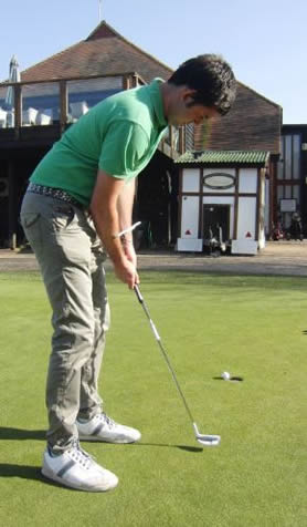 Golfer putting with T-Stroke