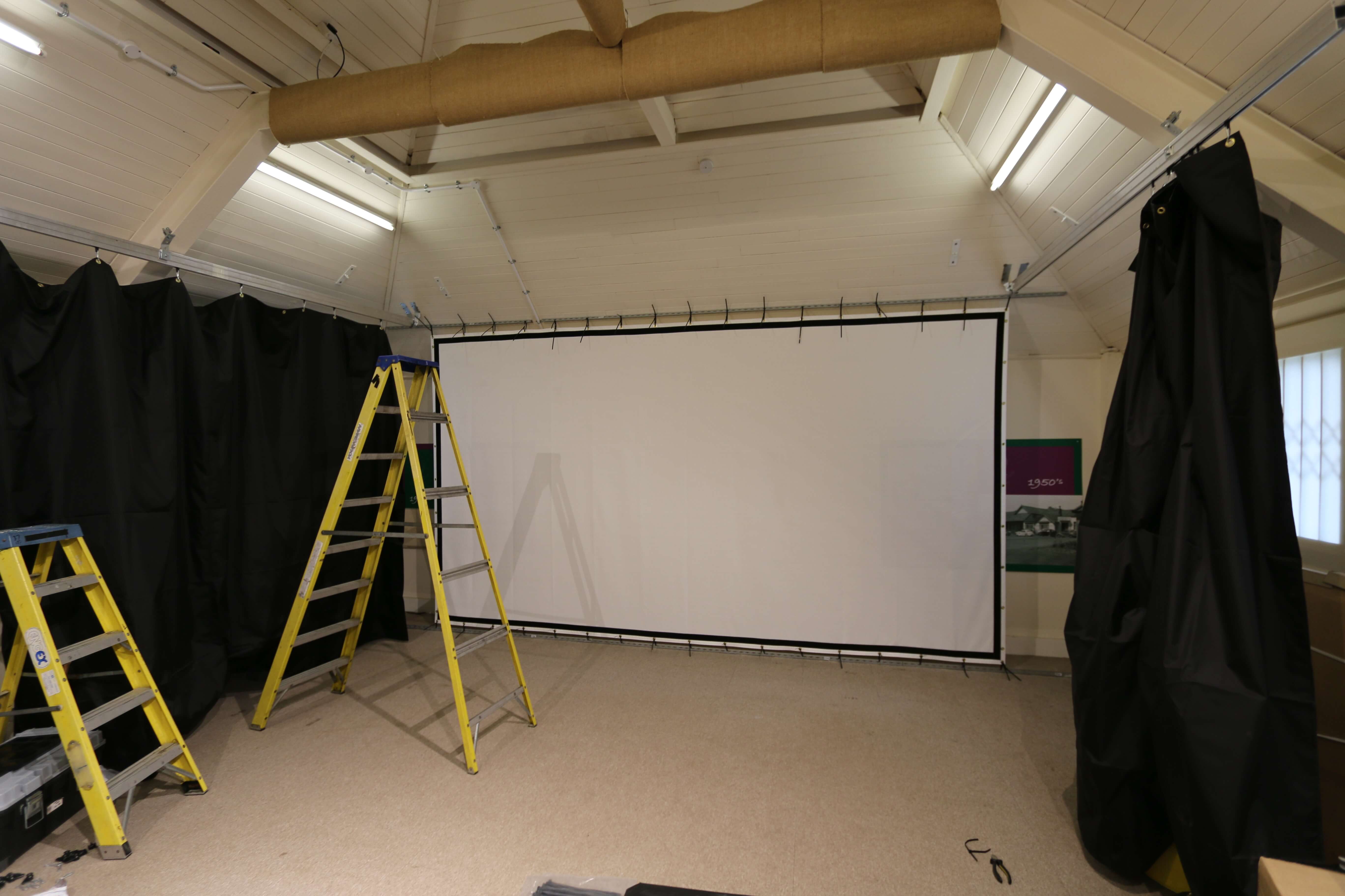 Installation of Screen and Curtaining.